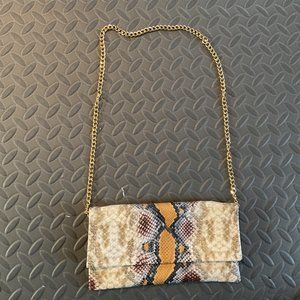 Snake skin patterned  purse.